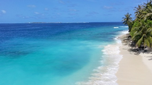 Aerial view of a Maldivian beach with turquoise water